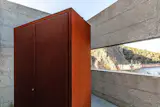 perforated corten steel and the bush-hammered concrete