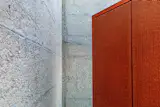 perforated corten steel and the bush-hammered concrete