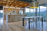 Dining Room, Ceiling Lighting, Table, Light Hardwood Floor, and Chair Kitchen / Dining Area  Photo 10 of 19 in Diamond Head Mountain House by Rob Paulus Architects