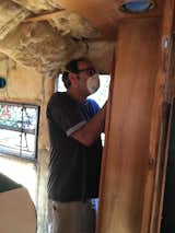 Stephen on day 1 of the gutting. So much nasty, itchy, old insulation.