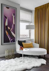 Bedroom, Chair, Dark Hardwood Floor, and Floor Lighting  The painting in the corner is from Adrian Fernandez’s “Requiem” series—an ongoing project that interrogates masculinity in 20th century Cuban postage stamps.   Photo 10 of 17 in Central Park West Penthouse by Decor Aid