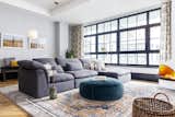 Housed in a recently converted industrial building in Brooklyn’s idyllic Dumbo neighborhood, our client and her husband had initially attempted to decorate their loft on their own but needed an interior designer’s wisdom to define the look they wanted for their home. When designer Maria T. first toured the space, it felt dark and spare as it was short on natural light and décor.