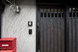 Rugged wall, red mail box, and retro lighting.