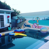 A wall mural completes the space. The perfect location for pool parties! Photo via Instagram @melwood_cabanas