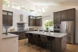 Chef's kitchen has massive island and tons of storage. Entertain while you prep, Socialize while you cook...