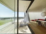 When open, corner windows in the main living area allow for a semi-outdoor transformation during summer months.