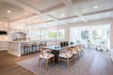 “This house is a mix of traditional architecture with contemporary open areas,” says architect Joe Spierer. “We integrated many expansive glass windows and doors, and attained a cleaner look without all the wainscoting and with less fussy molding."