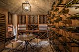 On the lower-level, a custom-built walnut wine cellar,  media room is equipped with a top-of-the-line surround sound system and custom floor-to-ceiling paneling, an exercise room, rec room with a bar, and a bonus room, as well as two full bedroom suites.