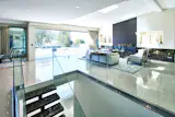This custom-built estate embraces indoor/outdoor living with an open floor plan and multiple entertainment areas.