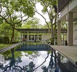 Outdoor, Stone Fences, Wall, Grass, Gardens, Garden, Vertical Fences, Wall, Metal Fences, Wall, Side Yard, Trees, and Large Patio, Porch, Deck  Photo 3 of 8 in BISHOPSGATE HOUSE by WOW Architects | Warner Wong Design