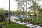 The modern pool house emphasizes indoor/outdoor living. Landscaping was done by Eschenfelder Landscape Design.
