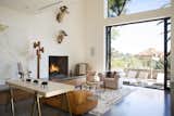 Below the loft bedroom, a living space with access to the indoor/outdoor spaces of the home