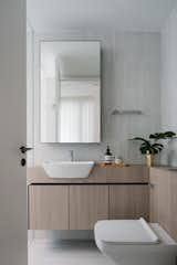 The Bath, finished in a muted palette of materials, continues the understated and pared down interior quality of the apartment.
