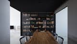 Dining Room, Wall Lighting, Table, Porcelain Tile Floor, and Chair Leaving the Master Bedroom, one returns to the Dining…  Photo 8 of 11 in Untitled #2 by Studio Wills + Architects