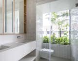 Placed within the 'gap', between the new extension and its adjoining neightbour, is the Master Bath that opens up to a view towards a planter.