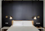 The BLACK BOX serves as a backdrop for the bed re-positioned to take in the view of the city.