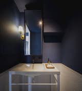 Bath Room, Engineered Quartz Counter, Undermount Sink, Wall Lighting, Mosaic Tile Wall, Subway Tile Wall, Ceiling Lighting, and Concrete Floor Within the BLUE BOX is a Blue Powder Room.  Photo 7 of 18 in Project #7 by Studio Wills + Architects