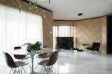 Living Room, Marble Floor, Table, Coffee Tables, Pendant Lighting, Floor Lighting, Chair, Recliner, Ceiling Lighting, and Lamps Looking back at the Foyer, the screen binds the 3 spaces and sets the ‘stage’ for Arrival, Resting, Entertaining and Dining.  Photo 3 of 11 in Project #9 by Studio Wills + Architects