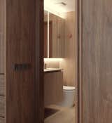 Inside the timber ‘box’ nests the Bathroom. Lined in complementing timber tiles, the Bathroom interior exudes warmth.