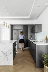Kitchen, Pendant Lighting, Ceiling Lighting, Quartzite Counter, Medium Hardwood Floor, and Undermount Sink  Photo 6 of 27 in B Apartment by Maya Sheinberger