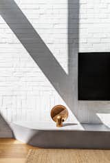 Living space detail featuring the Henry Wilson Surface Sconce.