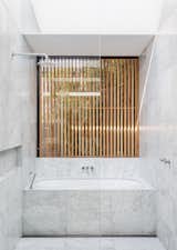 Bath Room, Marble Counter, Soaking Tub, Marble Floor, One Piece Toilet, Open Shower, Marble Wall, and Ceiling Lighting Custom Rosewood screens create privacy.  Photo 8 of 24 in Cloud House