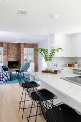 View from the kitchen into the living room with the original brick