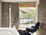 View of bedroom and outdoor porch by Low Design Office