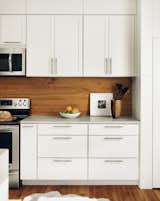 View of kitchen cabinets by Low Design Office