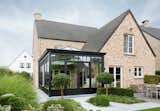 Exterior, Stone Siding Material, House Building Type, Tile Roof Material, and A-Frame RoofLine  Photos from Romantic Conservatory