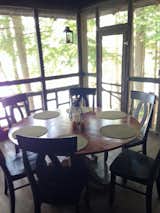 Screened-in porch, petrified birch table made by Staples Cabinetmakers