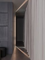 Corridor of the dwelling where you can see on the right a folded table on the wall.