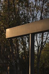 Detail of the rainwater gutter, reimagined as a sculptural element that extends beyond its functional role, defining the architectural identity of the project with its bold, linear presence.