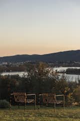 The house’s outdoor space opens towards an unobstructed view of Estany de Banyoles, with Palissade chairs by Ronan & Erwan Bouroullec for HAY blending effortlessly into the natural landscape.