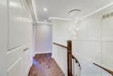 upstair hallway, accent lighting at crown mouldning. 2nd floor laundry on the left