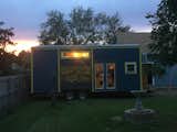 Tiny house with a metal mural from an old table top