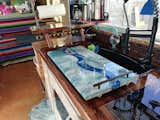 Kitchen board over sink or cooktop doubled as a snack tray. Made out of a free scrap of MDF