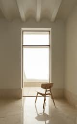 Living Room, Chair, Limestone Floor, and Recessed Lighting Living room to patio  Photo 11 of 25 in House of giants by Rubén Gutiérrez Rodríguez