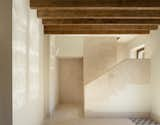 Living Room, Wall Lighting, and Limestone Floor Living room on first floor with stone handrail  Photo 20 of 25 in House of giants by Rubén Gutiérrez Rodríguez