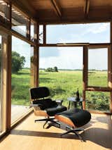 View of the reclaimed prairie. The Glass Cabin features large pieces of reused glass, Western Red Cedar and cork flooring.