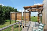 View of the reclaimed prairie from the west terrace with a trellis shade.