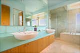 Glass and stone surfaces with radiant in-floor heat and solar on-demand hot water