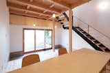 Living Room, End Tables, Ceiling Lighting, Chair, Accent Lighting, Light Hardwood Floor, Gas Burning Fireplace, Concrete Floor, and Standard Layout Fireplace  Photo 2 of 19 in A-small-house-in-higashimurayama by keigo iiduka