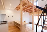 Living Room, Standard Layout Fireplace, Light Hardwood Floor, Accent Lighting, Chair, End Tables, Concrete Floor, Ceiling Lighting, and Gas Burning Fireplace  Photo 3 of 19 in A-small-house-in-higashimurayama by keigo iiduka