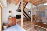 Living Room, Concrete Floor, Gas Burning Fireplace, End Tables, Chair, Ceiling Lighting, Standard Layout Fireplace, Light Hardwood Floor, Accent Lighting, and Coffee Tables  Photo 13 of 19 in A-small-house-in-higashimurayama by keigo iiduka
