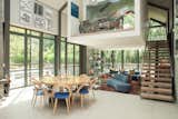 Beautiful light floods into the living, eating and a suspended bedroom.