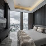 Bedroom, Ceiling Lighting, Bed, Travertine Floor, and Wardrobe Spectacle view of Bangkok skyline.   Photo 10 of 14 in The Ritz-Carlton Residences @Mahanakorn Building by Pitch Nimchinda