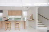 Kitchen, Porcelain Tile Floor, Laminate Cabinet, Marble Counter, Drop In Sink, and Recessed Lighting How to take nature benefit when we’re living inside  Photo 3 of 20 in Khun Kwin's Residence by Pitch Nimchinda