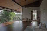 On the 2nd floor, high ceiling and vast multi-purpose wooden deck for daytime and nighttime collective activities.  Photo 9 of 19 in Baan Lek Villa by Pitch Nimchinda