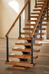 A Viewrail floating stairway with cable railing. The company believes in elevating the stairway from a functional feature to a room’s focal point.
  Photo 4 of 7 in A Modern Stairway That Brings Homes to the Next Level